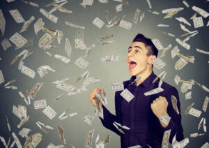 man surrounded by money